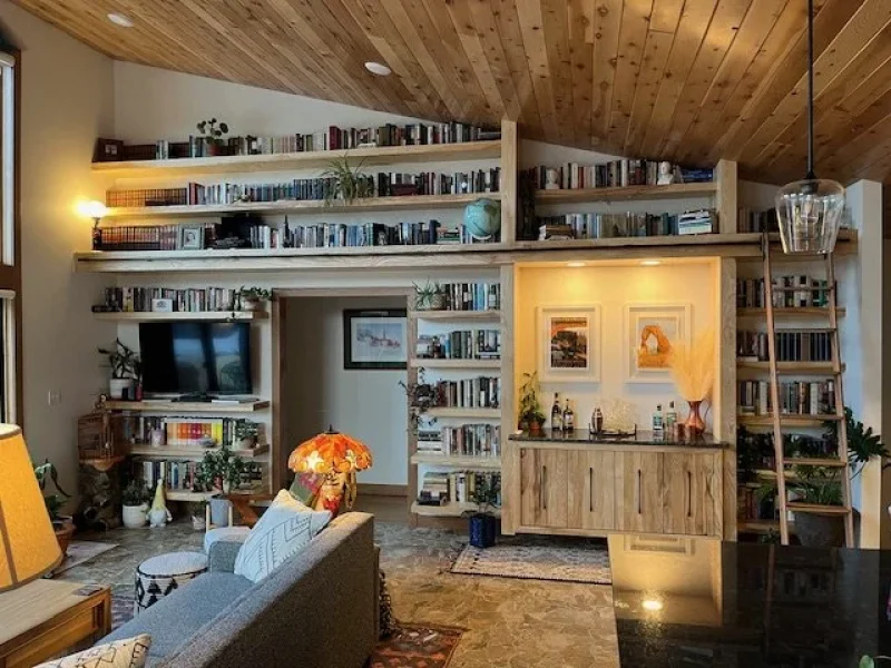 Custom built-in bookcase integrated into the room architecture